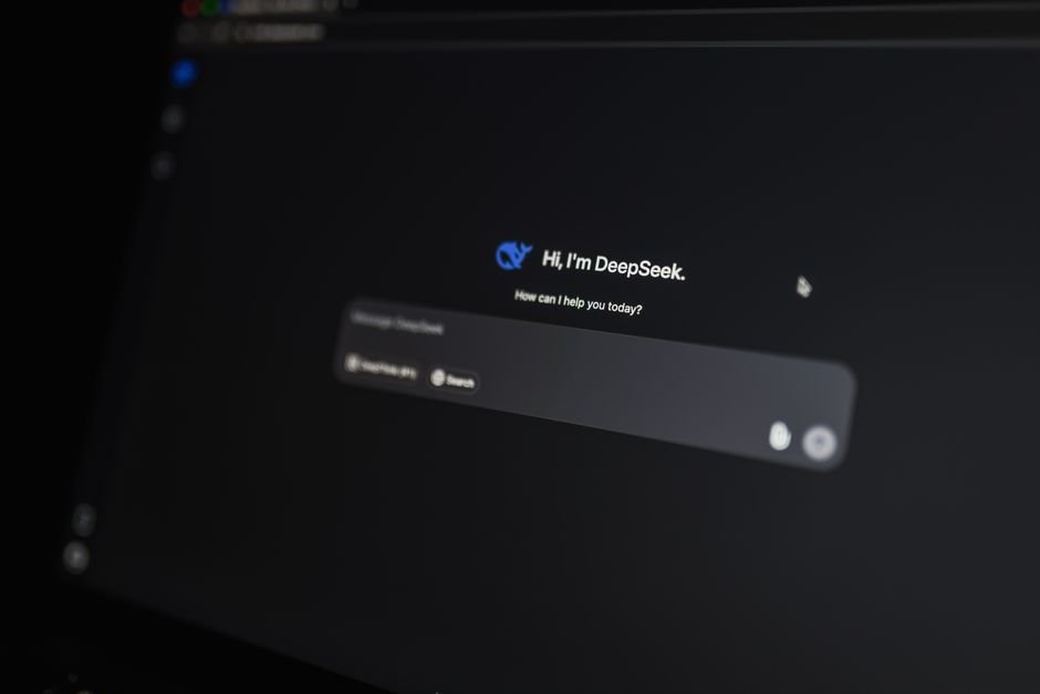 Close up of computer monitor displaying AI conversational logic and code generation