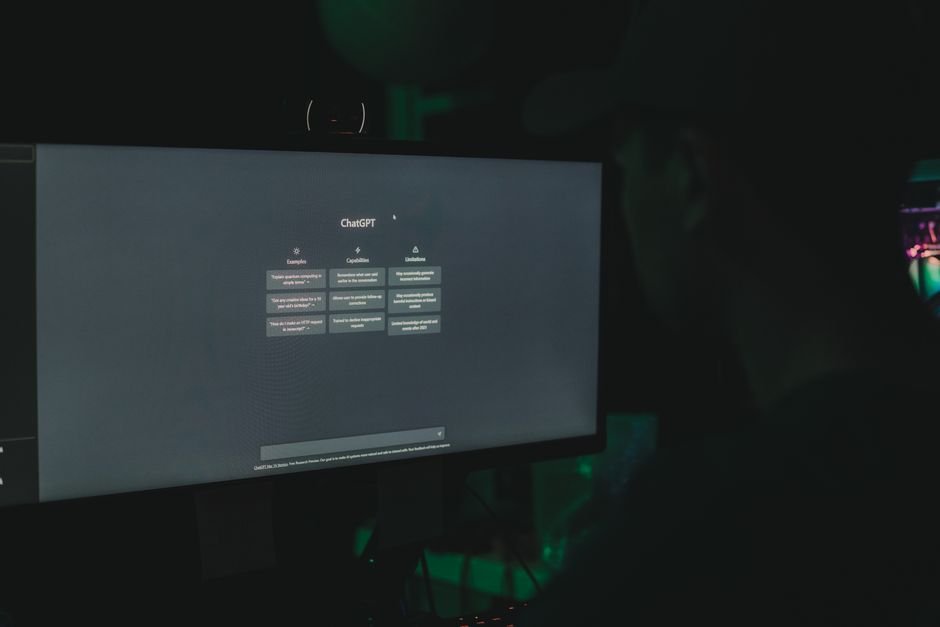 Student interacting with modern AI learning interface on computer screen in study room