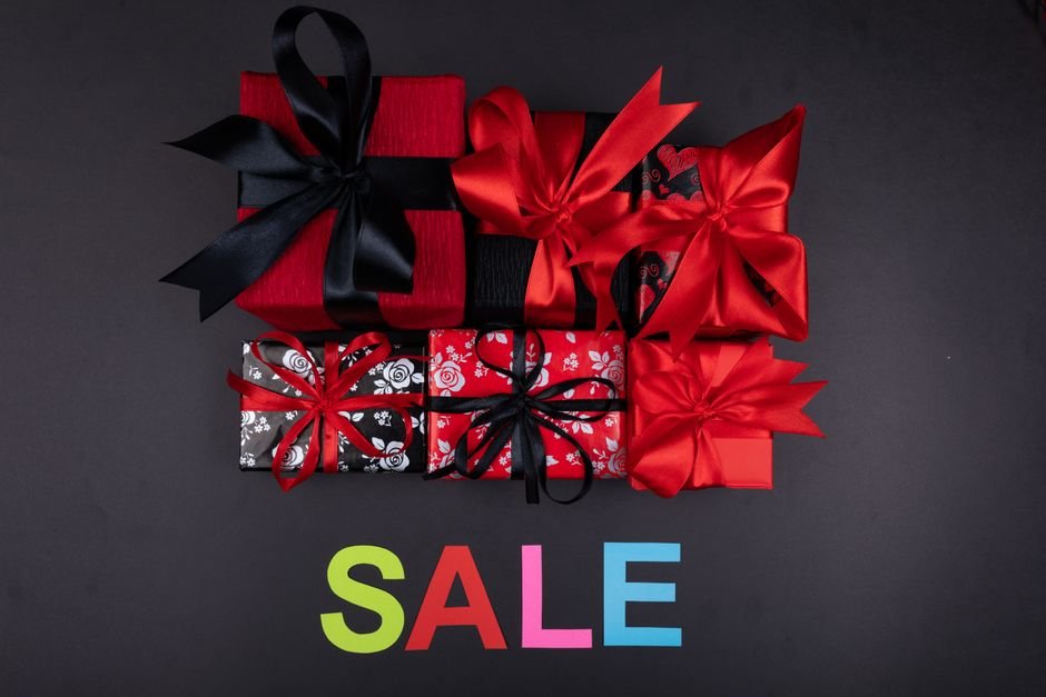 Assortment of vibrant wrapped holiday gift boxes arranged for festive tech shopping