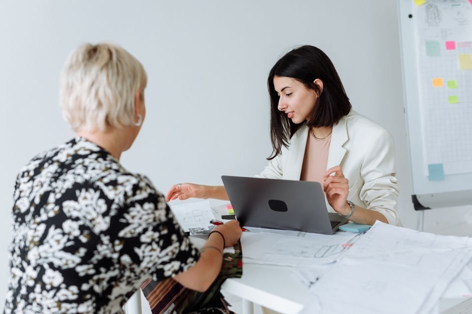 Two entrepreneurs reviewing business operations and scheduling automation tools