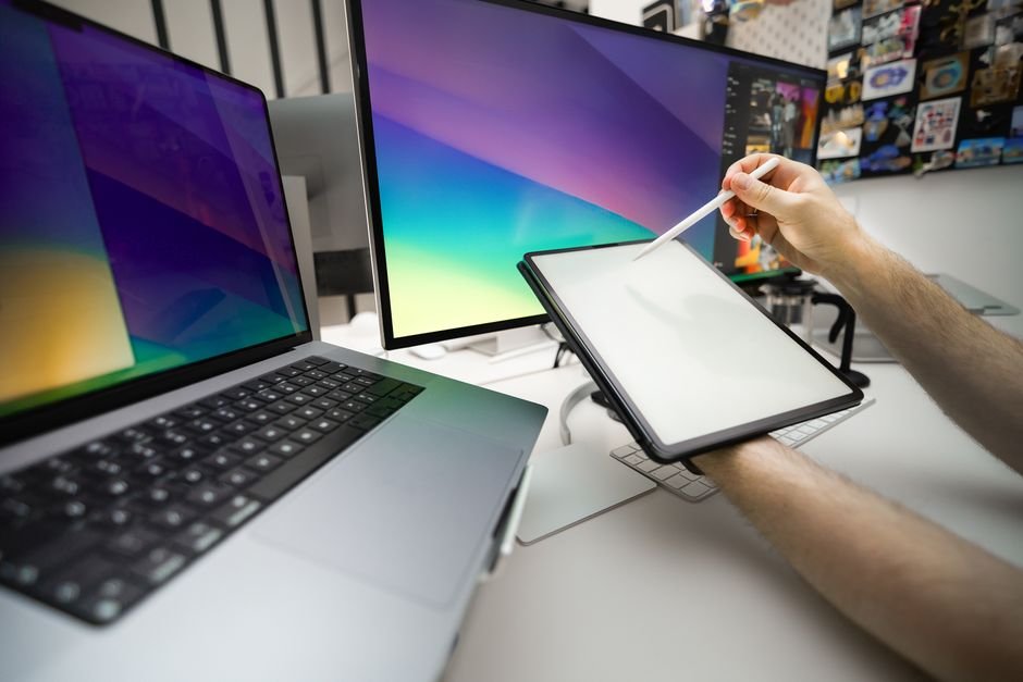 Modern mobile creative workspace with tablet displaying photo adjustments and editing tools