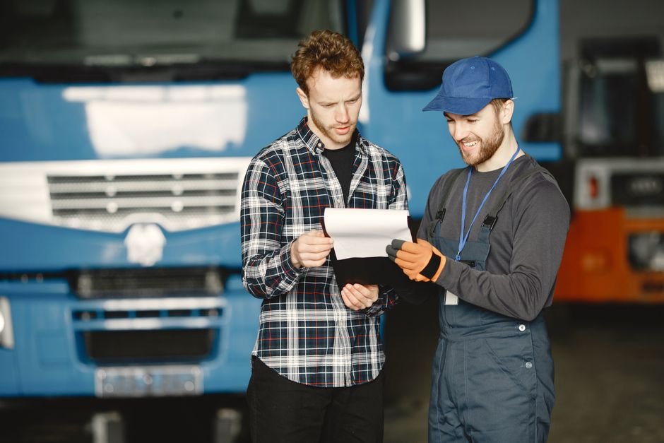 Customer and service manager reviewing official warranty policy documents and coverage clauses