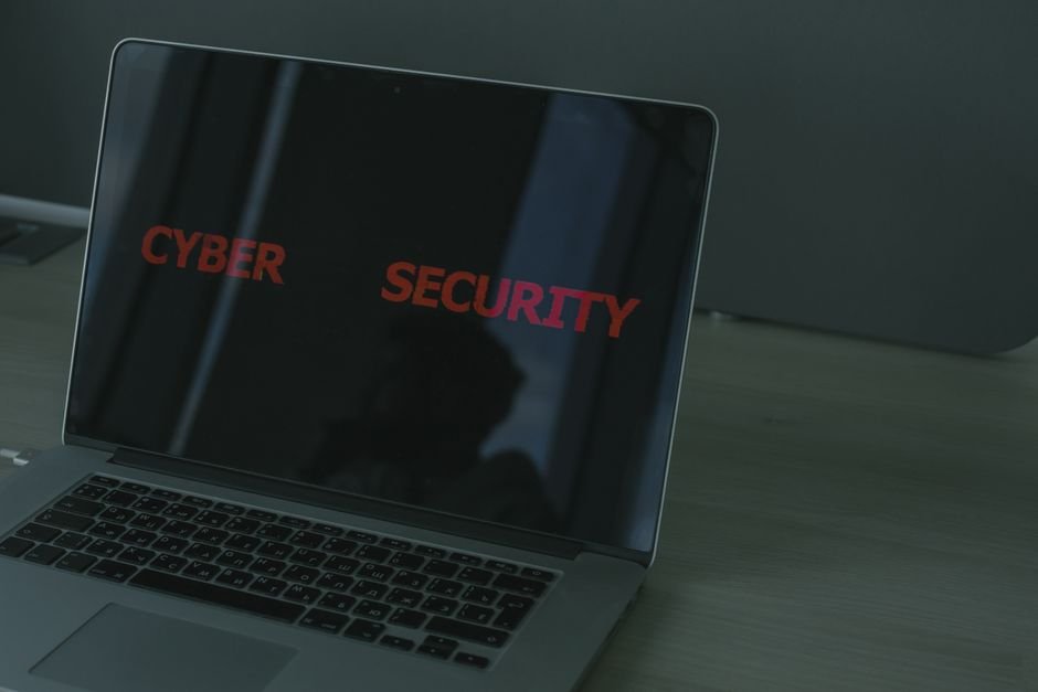 Laptop screen displaying cybersecurity firewall protocols and privacy warning diagnostics