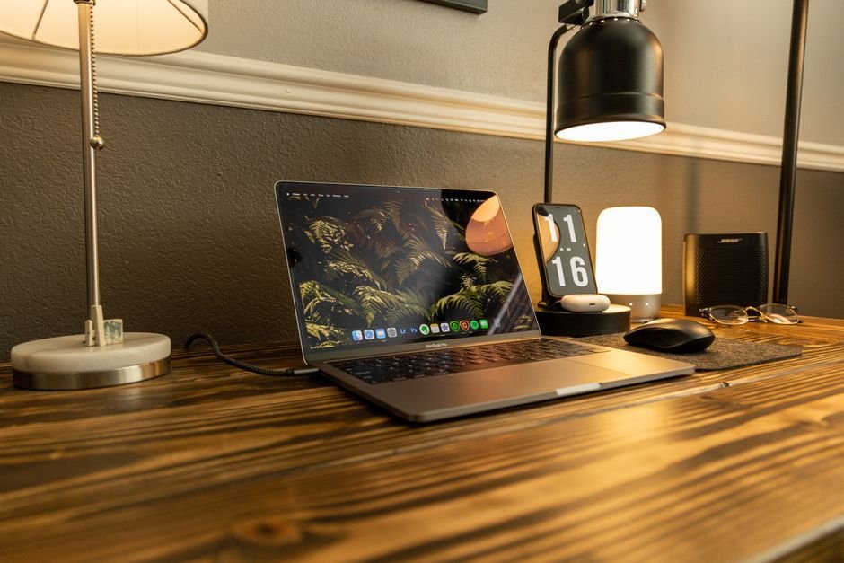 Organized home office desk showing clean cable routing and multi-device charging