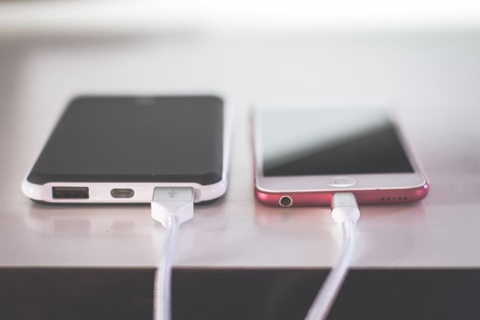 Two smartphones charging peacefully side by side demonstrating thermal safety