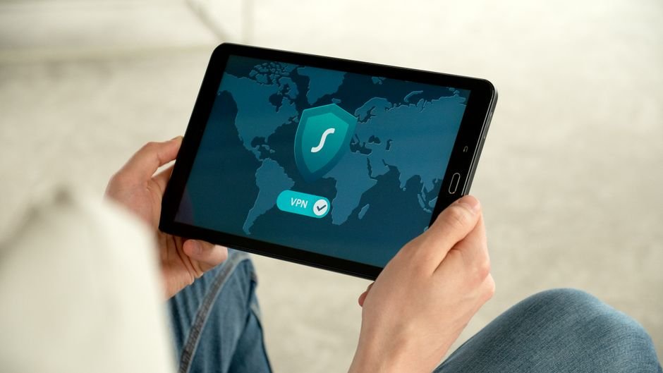 User managing encrypted network connection and privacy toggles on modern tablet