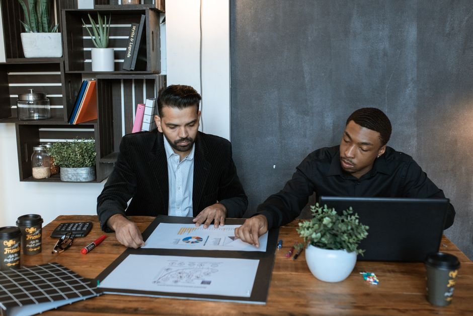 Business analytics charts and invoice tracking displayed on workstation screen