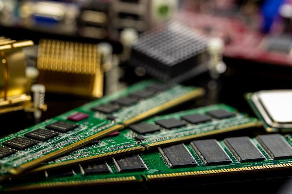 Macro close-up of computer RAM sticks and microchips on a motherboard