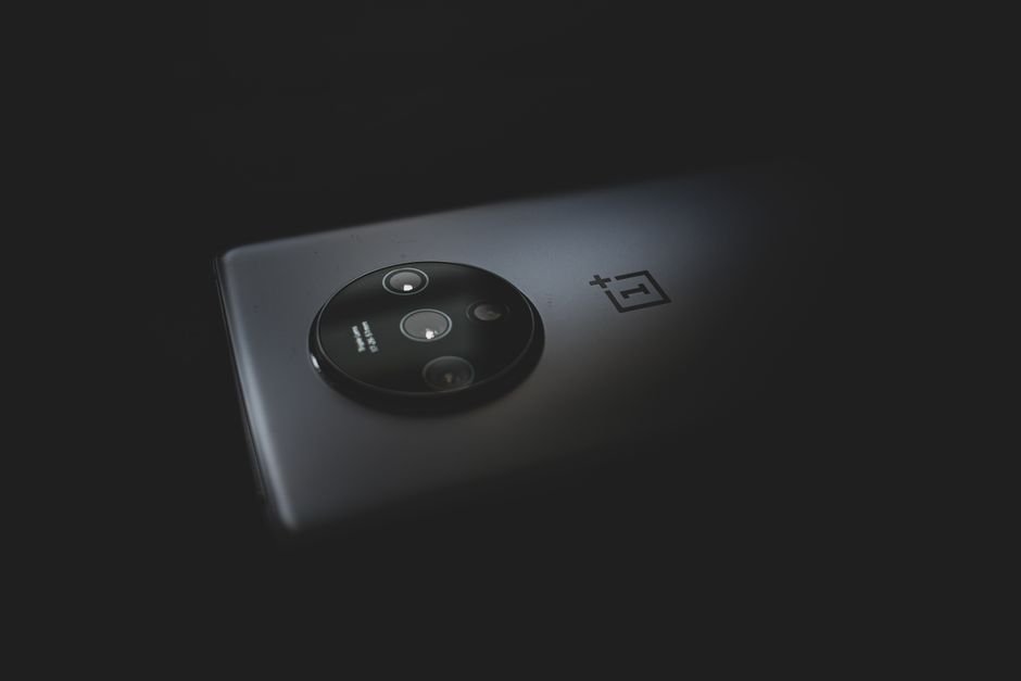Close up of modern multi lens smartphone camera system against dark backdrop