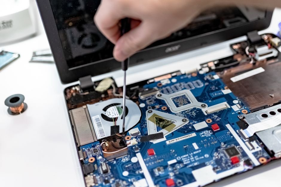 Opening laptop casing to inspect cooling fans and thermal paste degradation