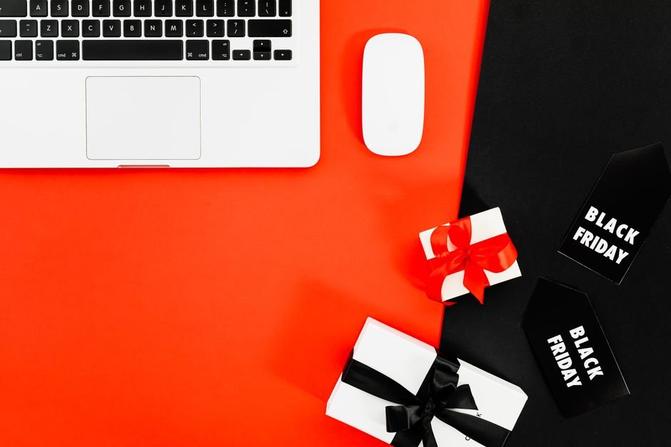 Laptop surrounded by gift boxes showcasing curated tech shopping ideas