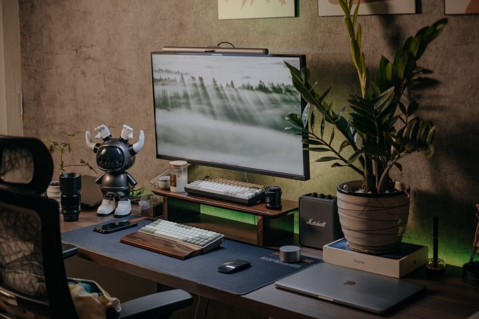 Ergonomic modern work from home tech desk setup with dual displays and accessories