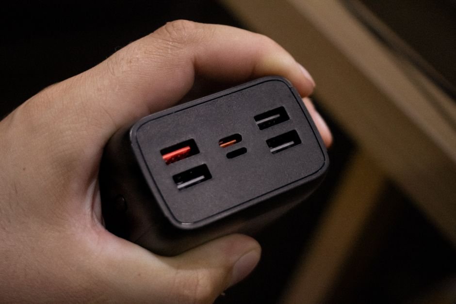 Close up of multiple USB Type-C and Type-A output ports on high power charging brick
