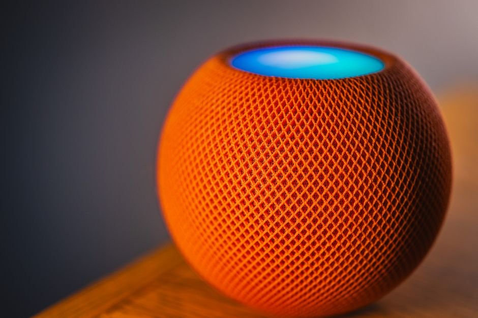 Smart voice assistant speaker illuminated with interactive blue status ring