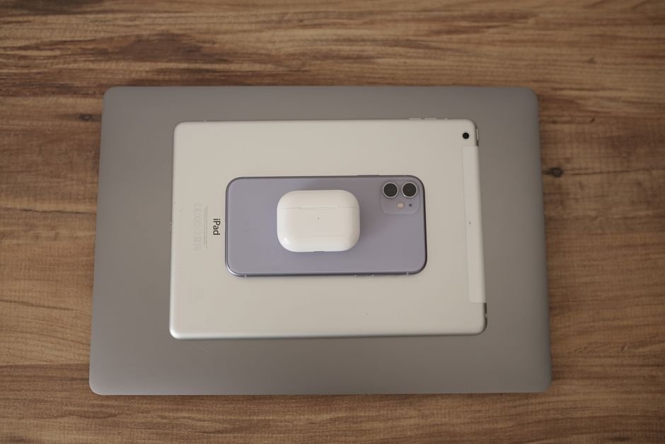 Flat lay of tablet with digital pencil and earphones for creative college productivity